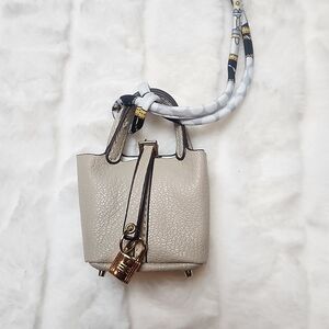Elegant Cream Handbag with Lock Detail